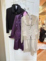 All three jackets hanging on door