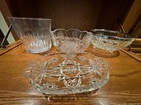 All four heavy crystal pieces displayed together for size and pattern visibility