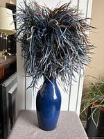 Full view of vase with artificial arrangement