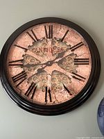 Front view of wall clock showing design and numerals