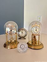 Group shot showing all four clocks and relative sizes
