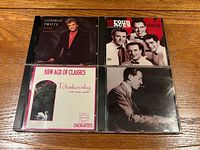 Front view showing all four CD cases and cover art