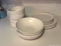 Stacked plates and bowls showing quantity and overall finish