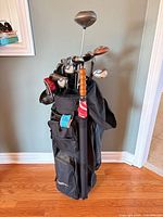 Full view of black stand bag filled with clubs