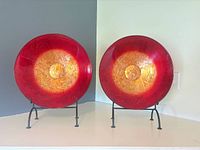 Both glass bowls on stands