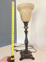 full view of lamp with measuring tape showing height