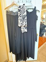 Group shot of all hanging garments and scarf