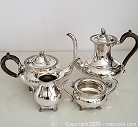 Group shot of all four silver-plated service pieces