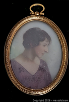 Close-up of miniature portrait in gold-tone frame