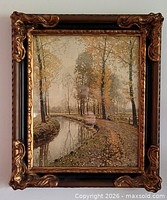 Front view of framed landscape print showing image and ornate gilt frame
