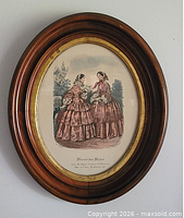 Framed lithograph on wall, full view