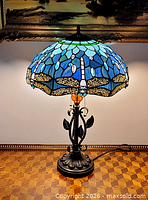 Full view of lamp lit, showing shade color and base