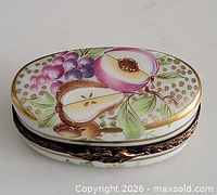 Top view showing fruit design and gilt rim
