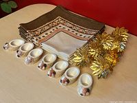 Group shot of napkins stacked with both sets of napkin rings