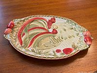 Full top view of oval Royal Doulton Chantclair platter showing rooster motif and side handles