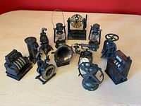 Group shot showing all twelve cast metal miniature sharpeners