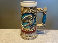 Full view of ceramic beer stein showing eagle relief and handle