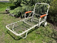 Full view of Simmons folding chaise lounge on grass