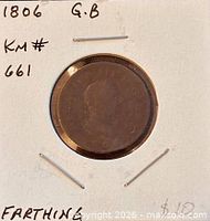 Obverse of 1806 farthing in holder with handwritten details