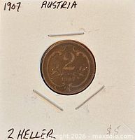 Obverse of 1907 Austria 2 Heller coin in holder