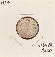 Reverse of 1934 Canadian 10-cent coin showing crown, denomination, maple leaf wreath