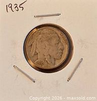 Obverse of 1935 Buffalo nickel in flip