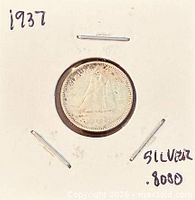 Coin reverse with Bluenose schooner visible in holder