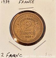 coin in flip, reverse showing denomination