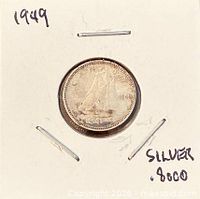Overall view of coin in holder marked silver .800