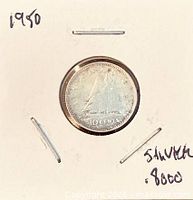 Coin in 2×2 flip showing reverse with Bluenose schooner and date 1950