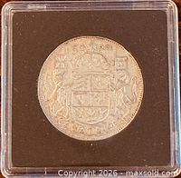 Reverse showing Canadian coat of arms and denomination