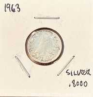 Coin in 2x2 holder, year 1963 noted