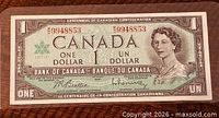 Obverse of the 1967 Canadian $1 banknote with Queen Elizabeth II portrait and serial number