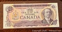 Front of 1971 $10 note showing portrait, coat of arms, serial number ETR921495