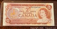 Obverse showing full note with Queen Elizabeth II and serial number