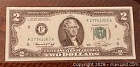 Obverse of the 1976 $2 note showing serial number, portrait, denomination