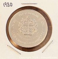 Obverse of 1986 St. Catharines trade dollar in holder