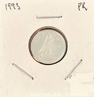 Coin in 2x2 holder showing reverse Bluenose schooner design