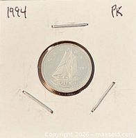 Full view of coin in 2x2 cardboard flip with date notation