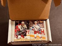 Open box showing top row of Pinnacle hockey cards