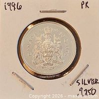 Coin reverse featuring Canadian coat of arms in 2×2 flip