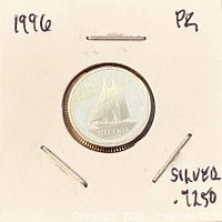 Coin in 2x2 holder showing reverse with Bluenose schooner
