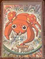 Front of 1999 Topps Pokémon card #46 Paras in sleeve