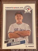 Front of John Gibbons trading card showing portrait and team branding
