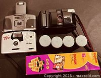 Three cameras, four canisters, Kodak Gold 200 film box