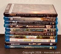 Stack of 10 Blu-ray/4K movie cases showing spines