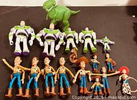 All 17 Toy Story figures laid out, showing character variety and sizes