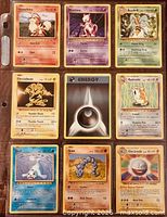 Front view of nine Pokémon cards in binder sleeve