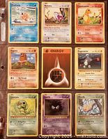 Front view of nine Pokémon cards in binder page