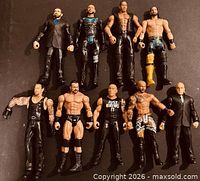 Group shot of all nine WWE action figures
